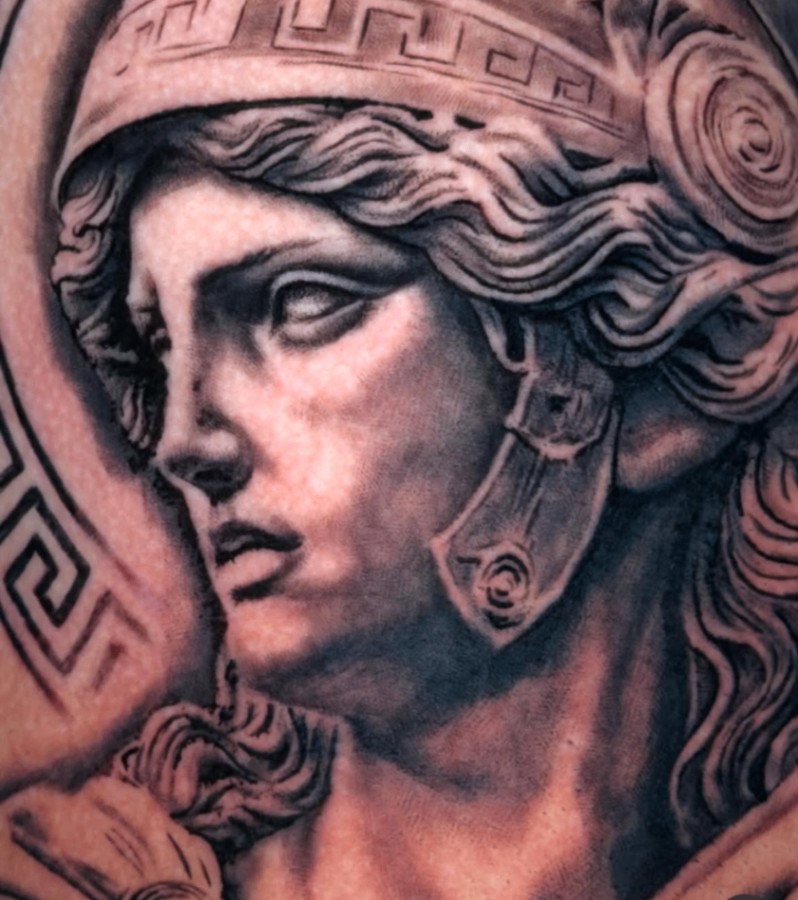 Close-up detail of Athena realism tattoo