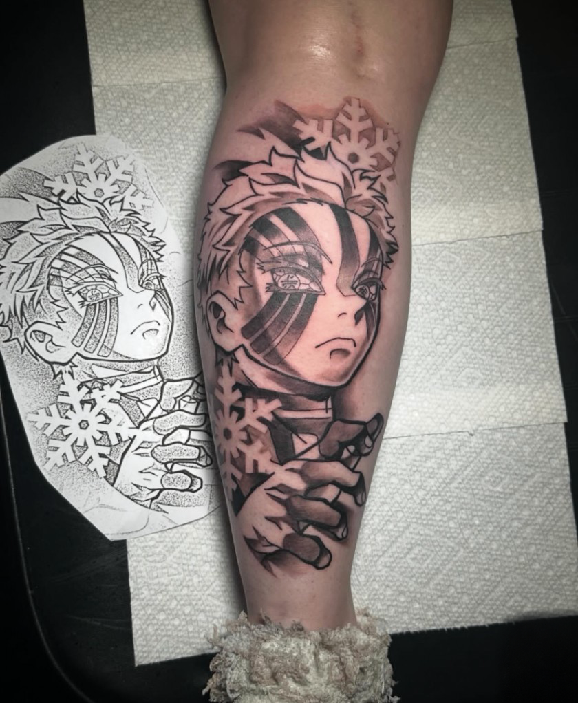 Akaza anime tattoo with snowflakes, calf
